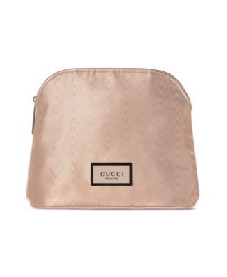 Gucci - FREE  Bloom pouch with a $168 purchase from the Gucci Fragrance collection.